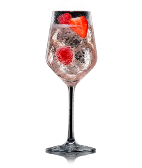 Lillet Wild Berry im Weinglas mit Erdbeere und Himbeeren, aufgegossen mit Schweppes Original Wild Berry.